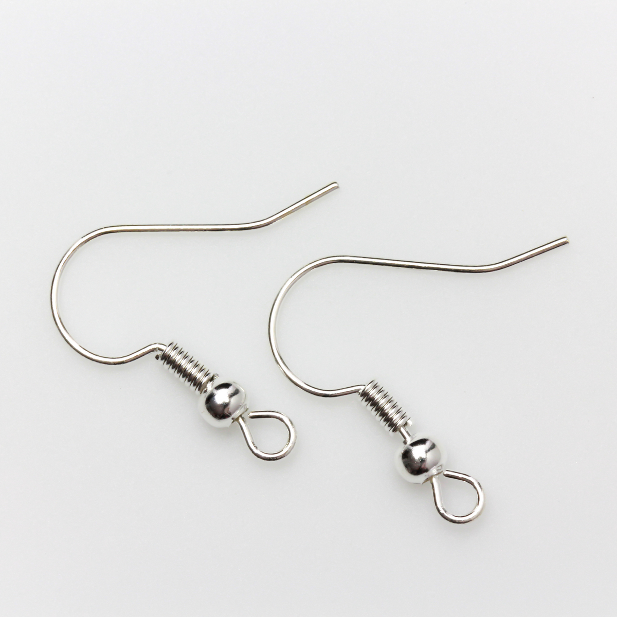 earring hooks with a horizontal loop and a shiny platinum silver finish, 23 gauge wire. Sold in packages of 30 hooks (15 pairs)
