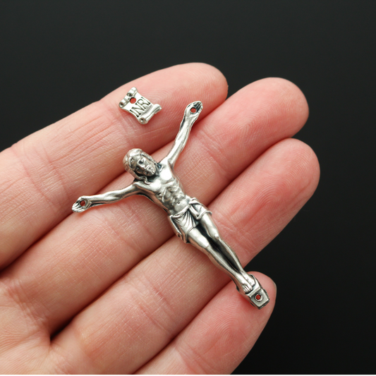 1.625" long corpus that comes with an INRI scroll that can be attached to a cross using the pre-drilled 2mm holes