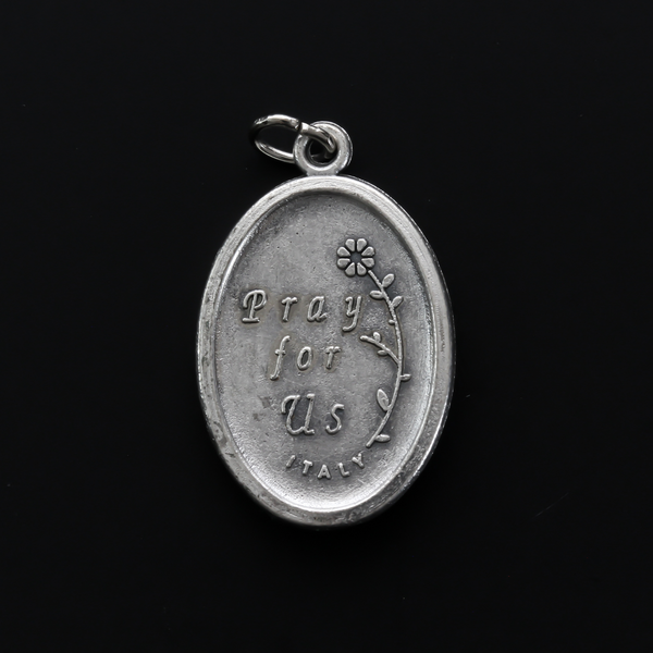 Saint Anthony of Padua oval medal that depicts the saint on the front and "Pray For Us" on the back