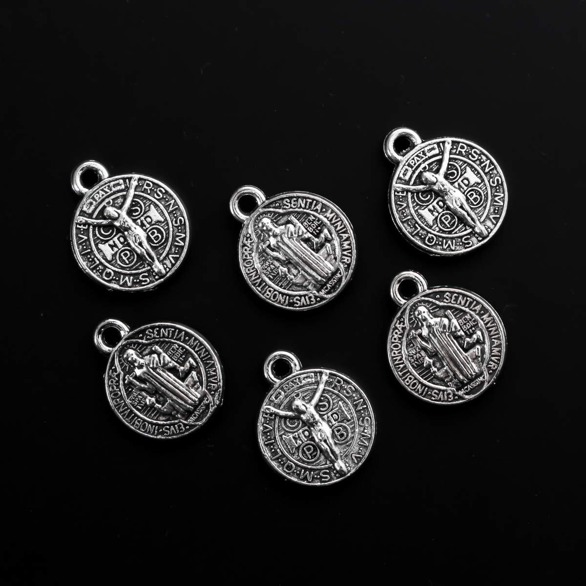 Round Saint Benedict medal with Crucified Jesus Christ on the backside