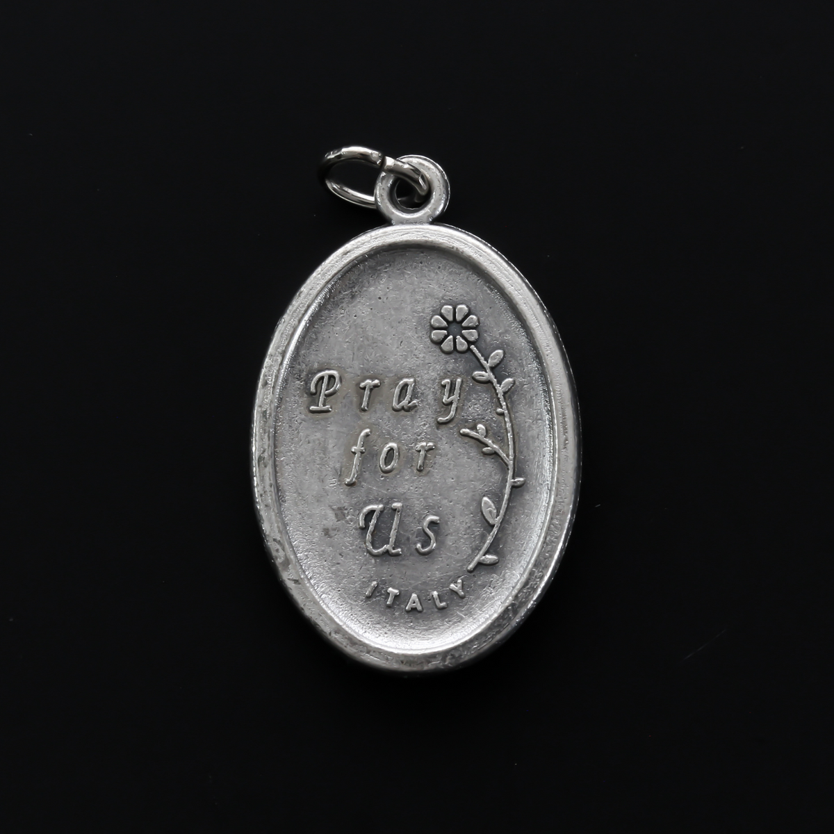 Saint Catherine of Sweden medal that depicts the saint on the front and is marked "Pray For Us" on the back