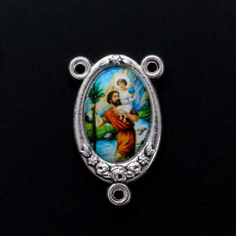 Rosary centerpiece that has a color image of Saint Christopher inlaid in a silver oxidized Center with flower detailing along the edge