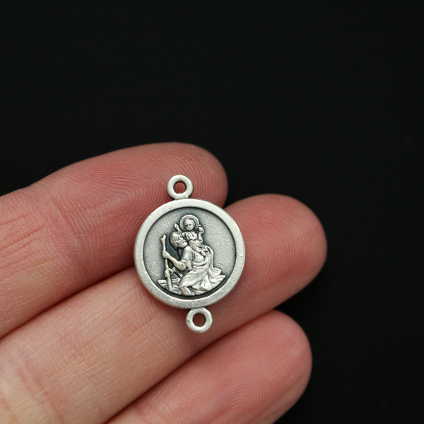 Saint Christopher round flat connector links that are silver oxidized plating on a base metal.