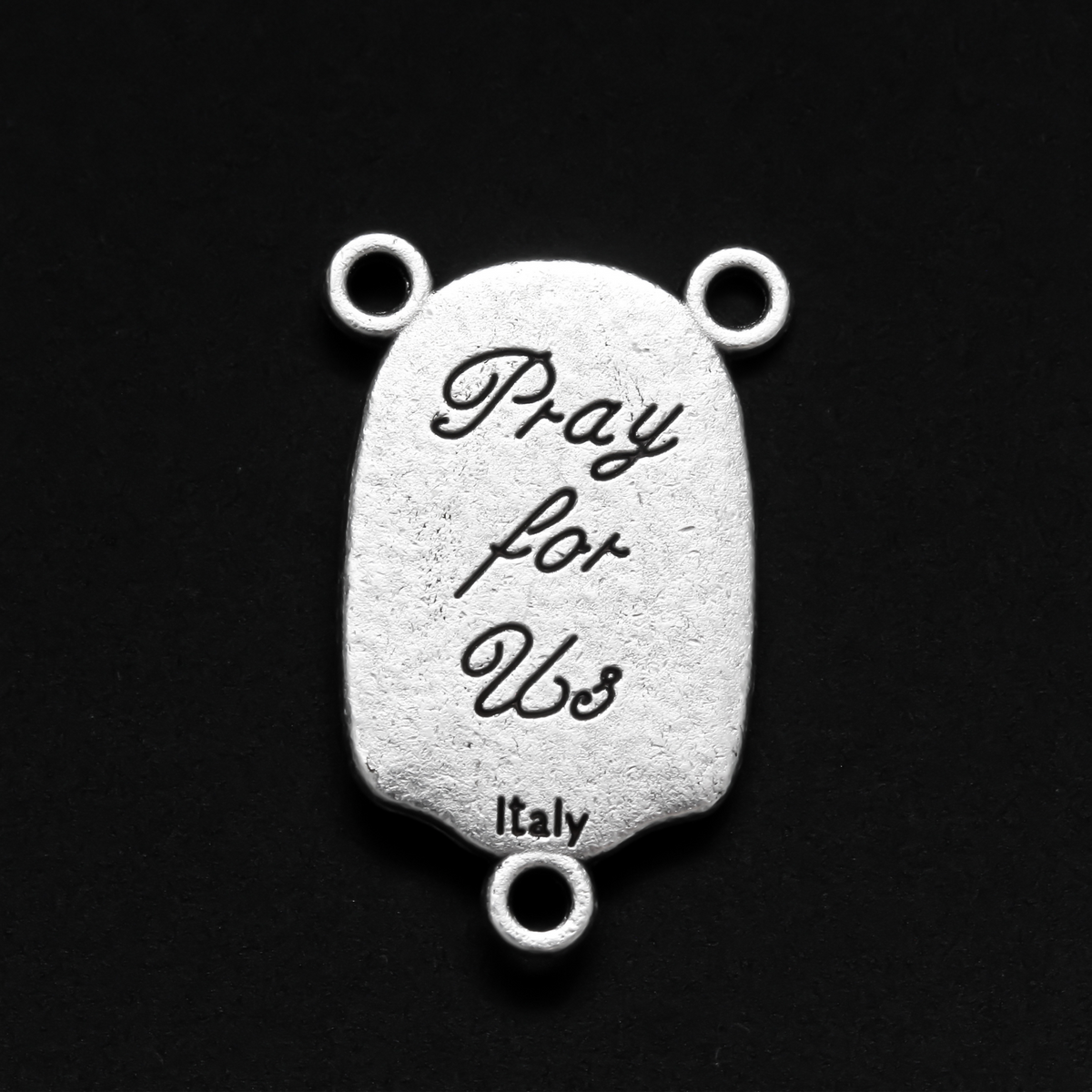 Rosary centerpiece that depicts St. Christopher with child Jesus on his shoulders on the front, the reverse is marked "Pray For Us"