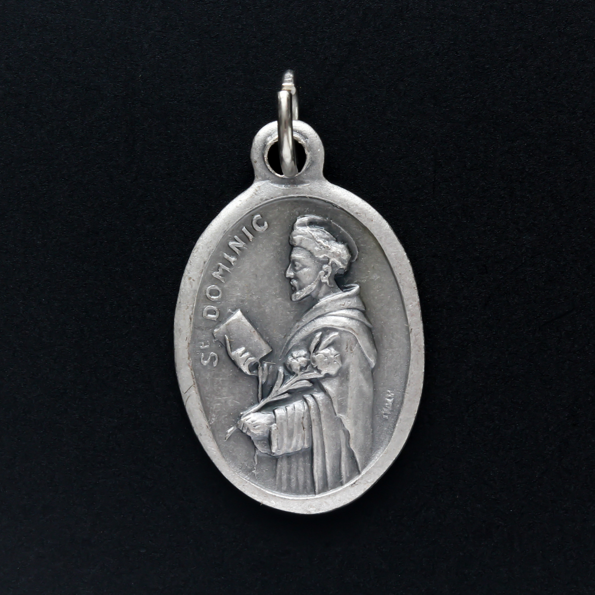 saint dominic silver oxidized one inch oval medal handcrafted in italy