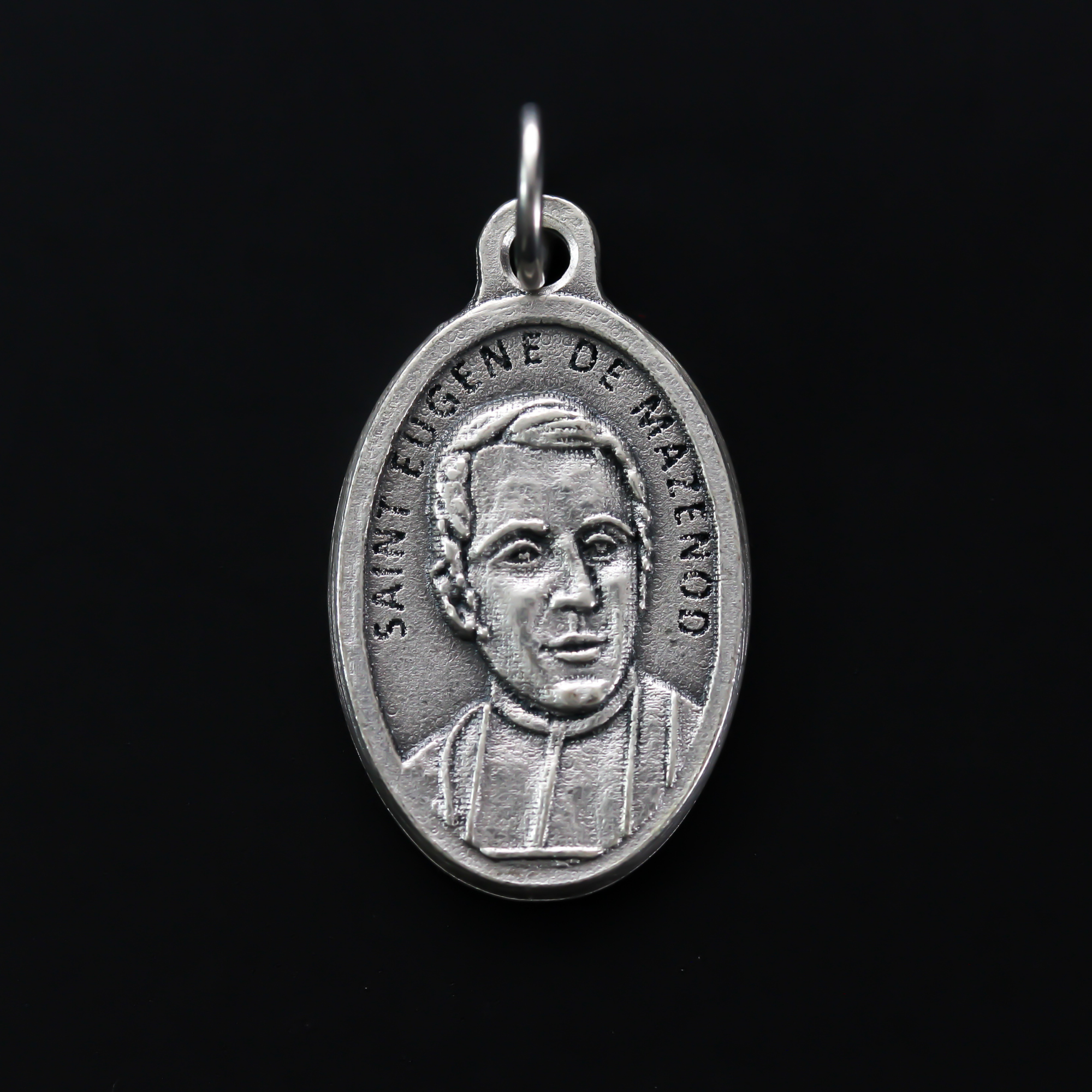Saint Eugène de Mazenod medal that depicts the saint on the front and "Pray For Us" on the backside.