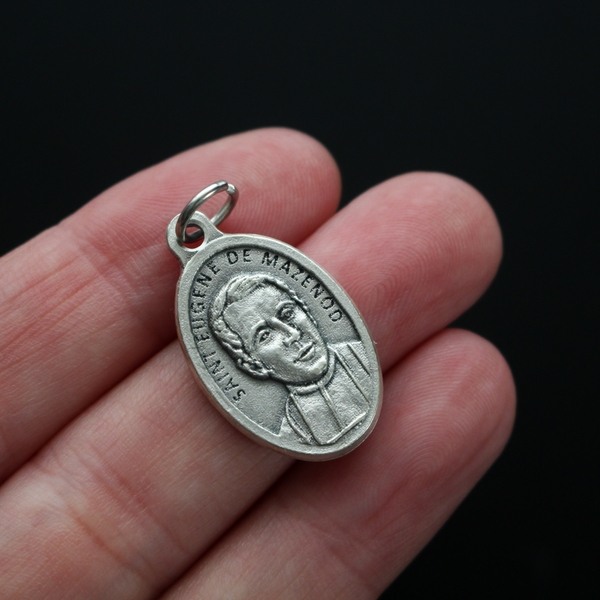Saint Eugène de Mazenod medal that depicts the saint on the front and "Pray For Us" on the backside.