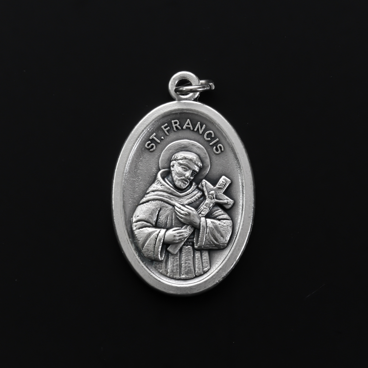 Saint Francis of Assisi medal that depicts the saint on the front and "Pray For Us" on the back