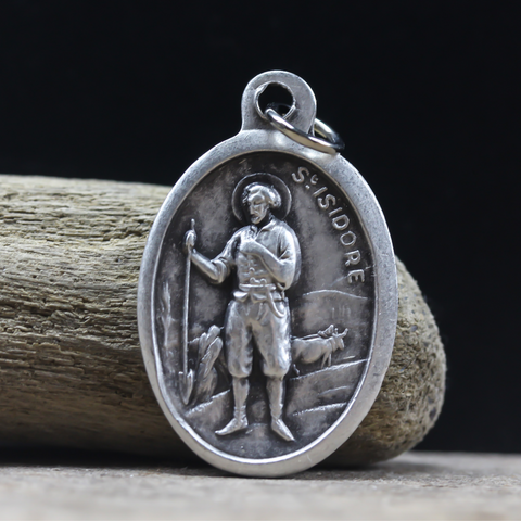 saint isidore the farm laborer one inch oval die cast medal
