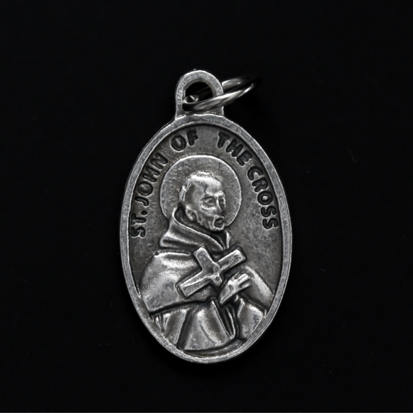 Saint John of the Cross medal that depicts the saint on the front and "Pray For Us" on the back