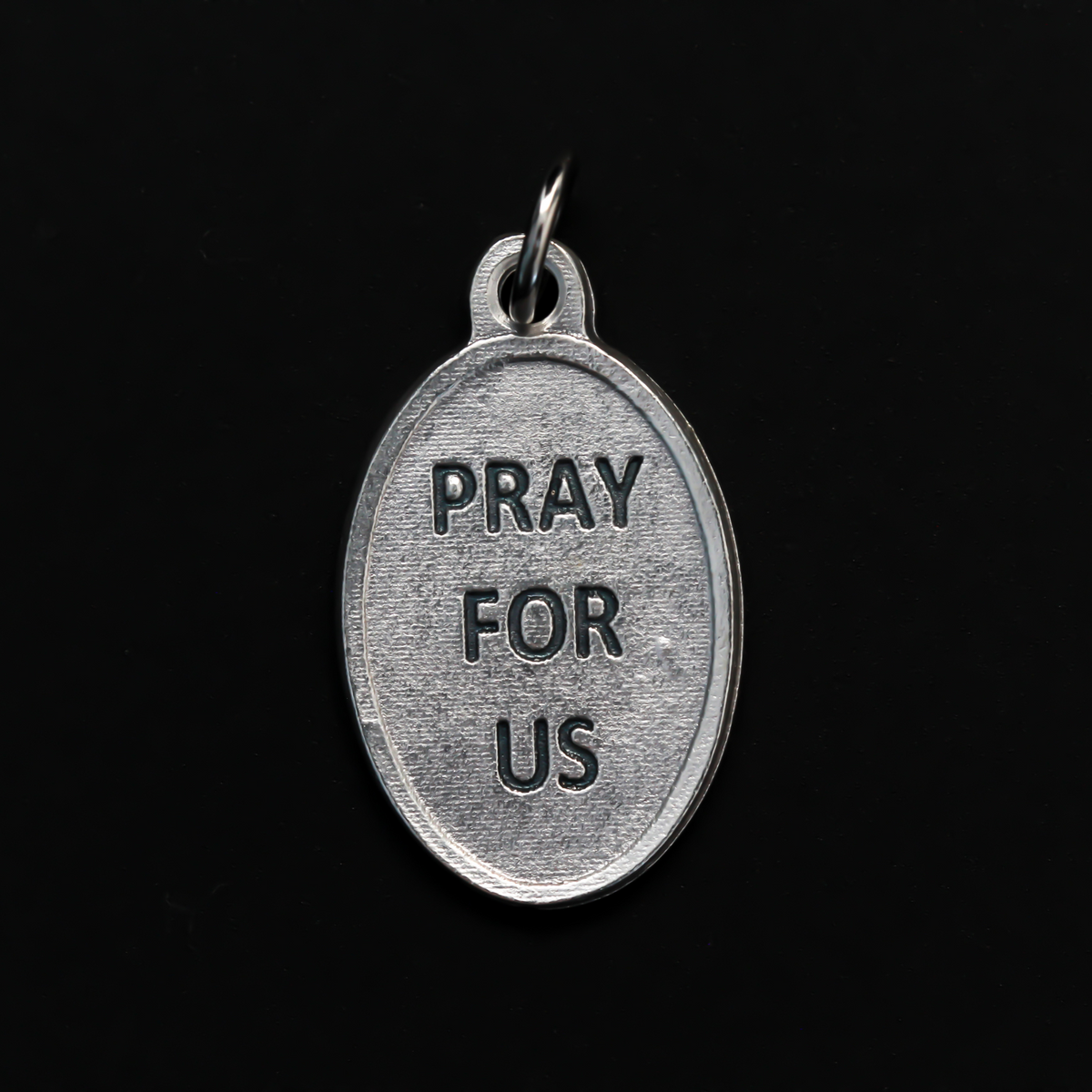 Saint John Henry Newman medal that depicts the saint on the front and is marked "Pray For Us" on the back