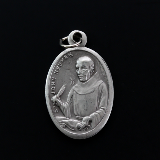 Saint John Neumann medal that depicts the saint on the front and "Pray For Us" on the back.
