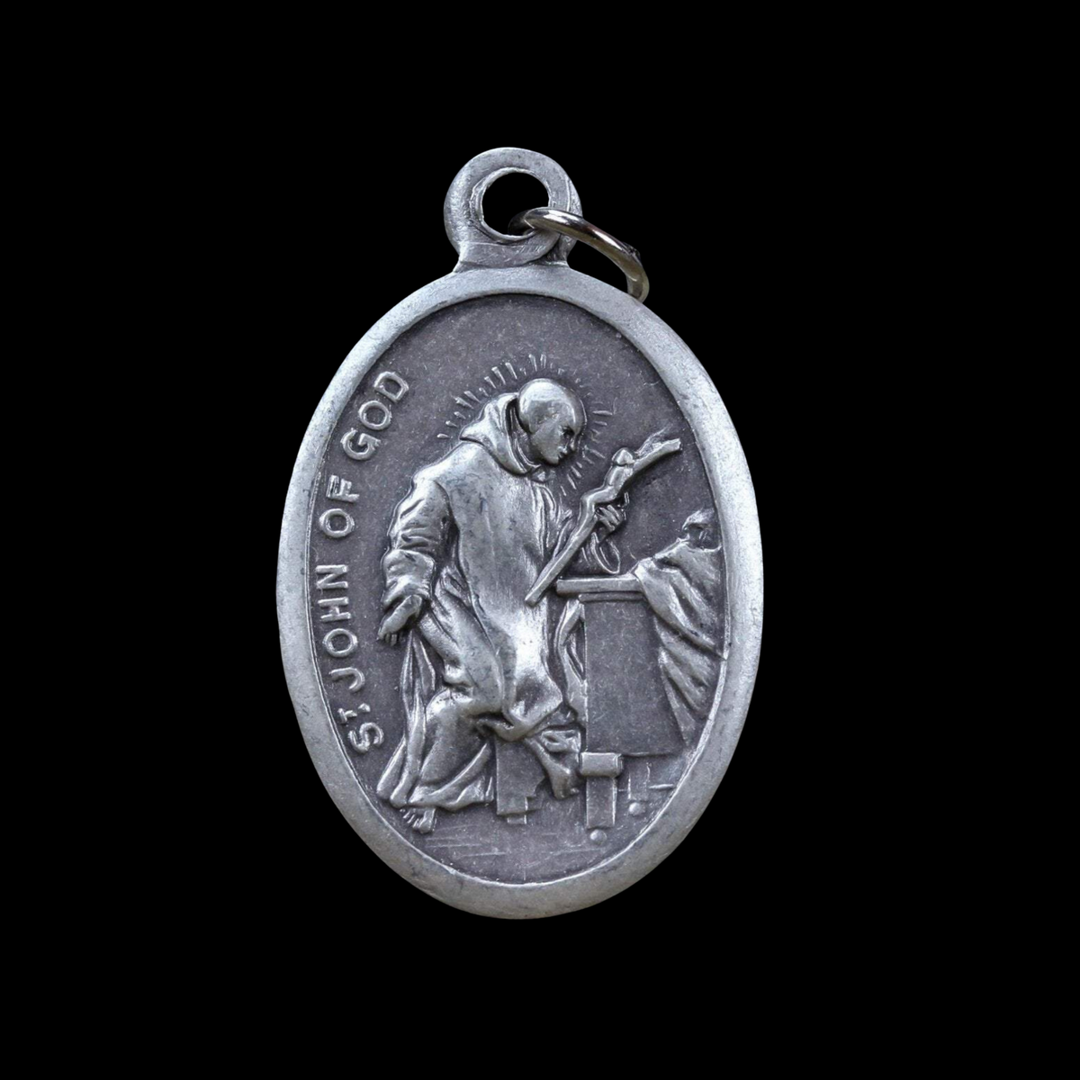 die cast silver medal depicting saint john of god