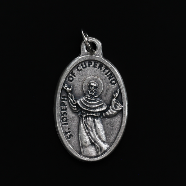 Saint Joseph of Cupertino medal that depicts the saint on the front and "Pray For Us" on the backside