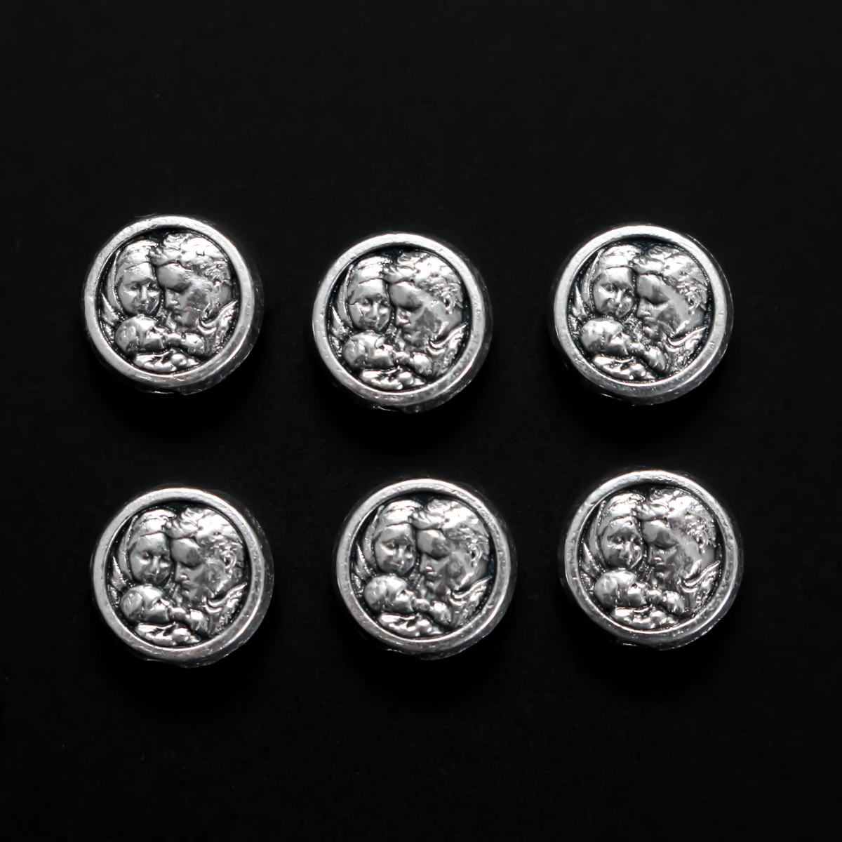 Metal spacer beads with Saint Joseph holding child Jesus on one side and Jesus, Joseph, and Mary on the other side 9.5mm in diameter