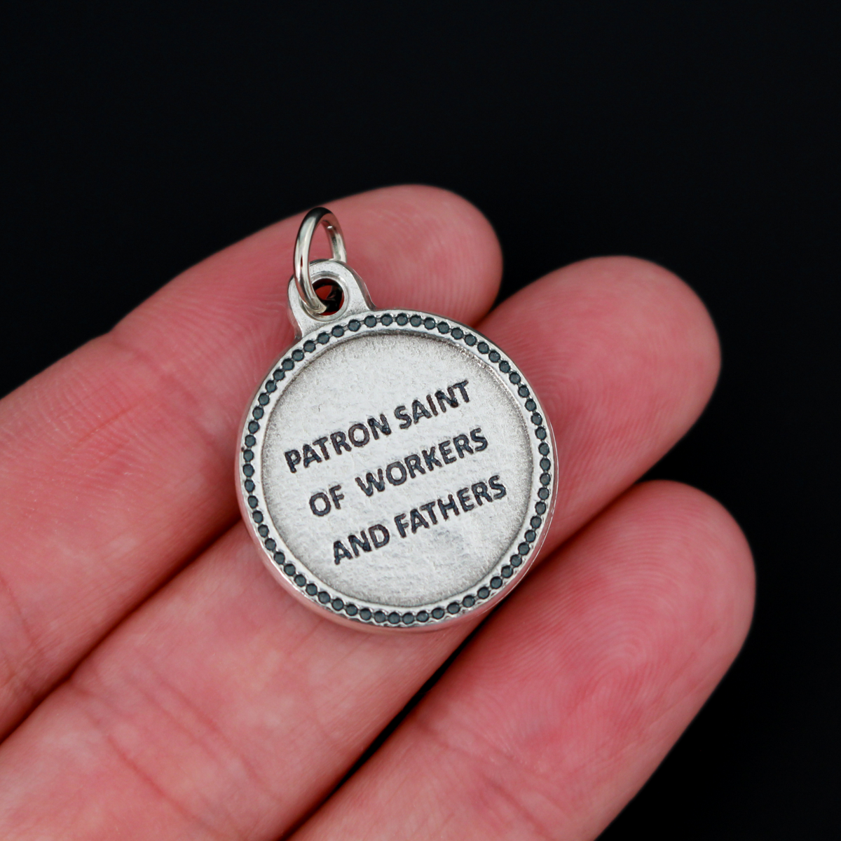 Saint Joseph medal that is round in shape