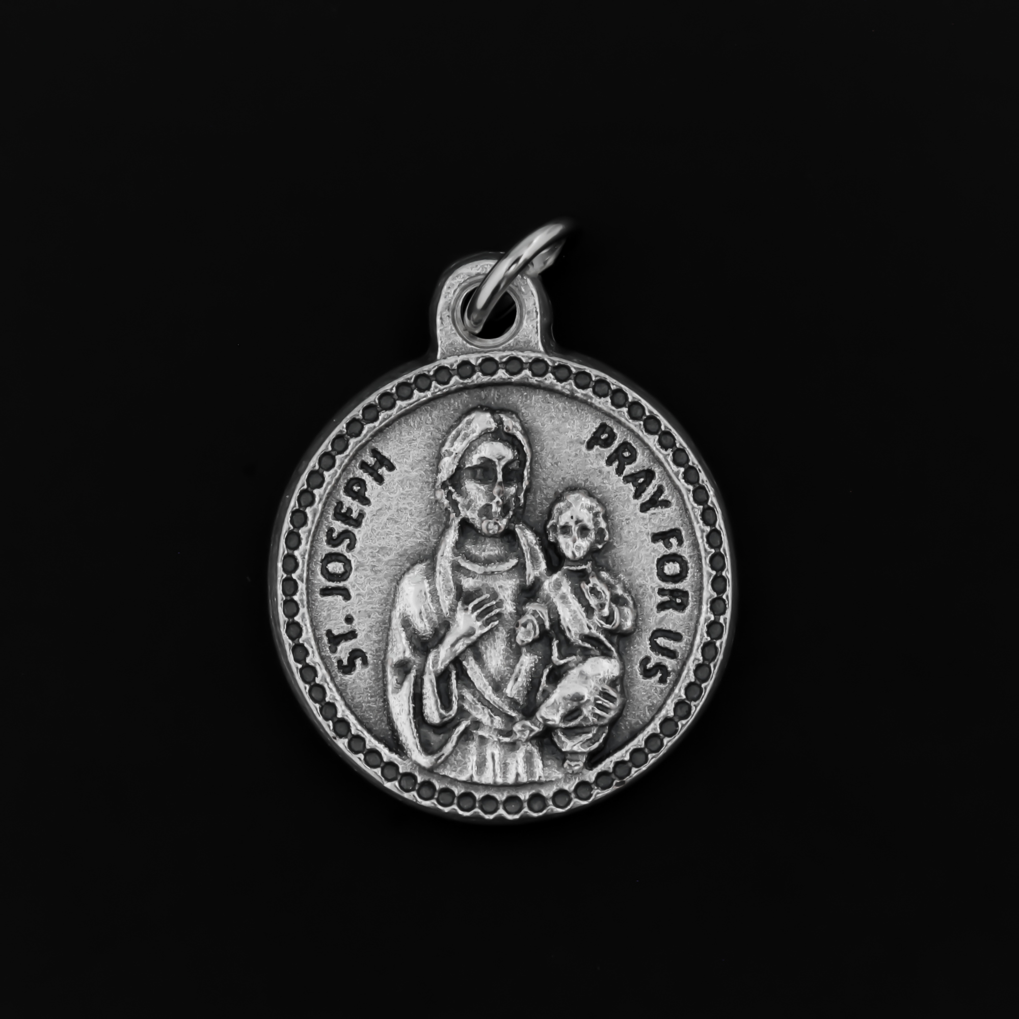 Saint Joseph medal that is round in shape