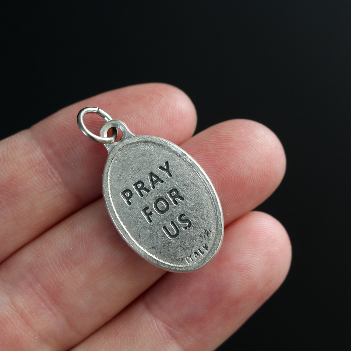 Saint Margaret of Castello medal that depicts the saint on the front and "Pray For Us" on the back