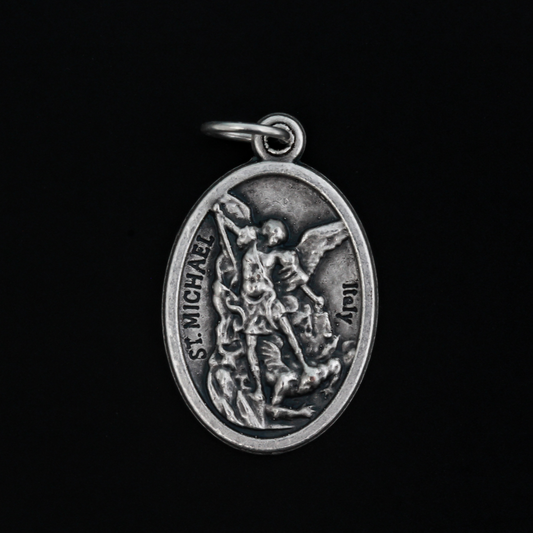 Archangel Michael oval medal. The front depicts St. Michael, the warrior angel of protection and the reverse is marked "Protect Us".