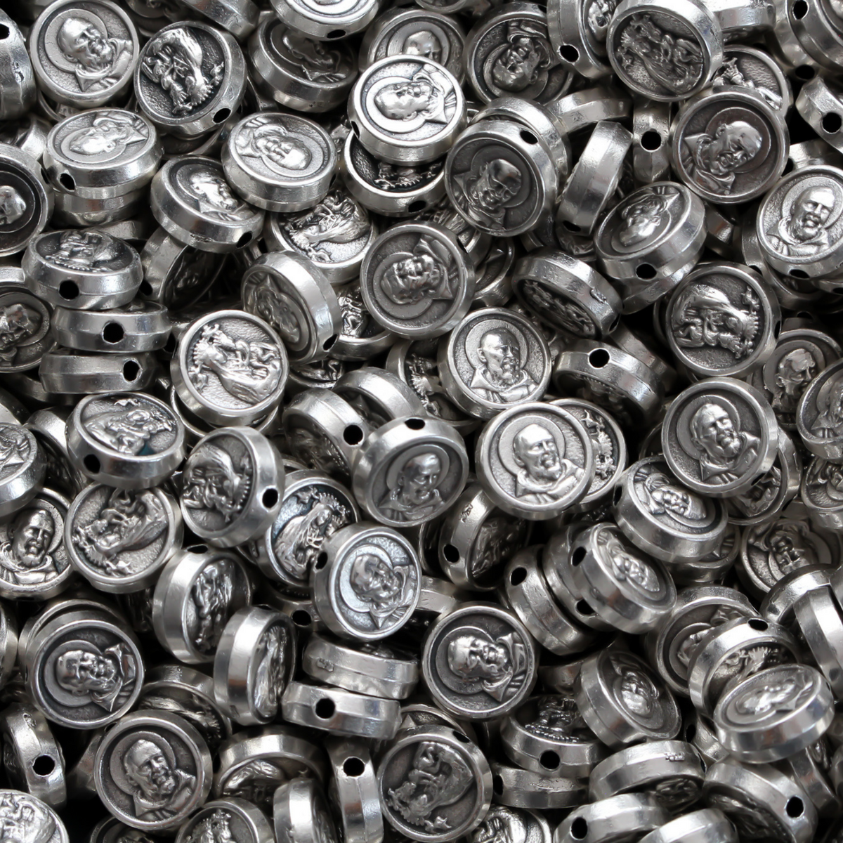 Metal spacer beads that depict Saint Padre Pio on one side and Our Lady of Perpetual Help on the other side.