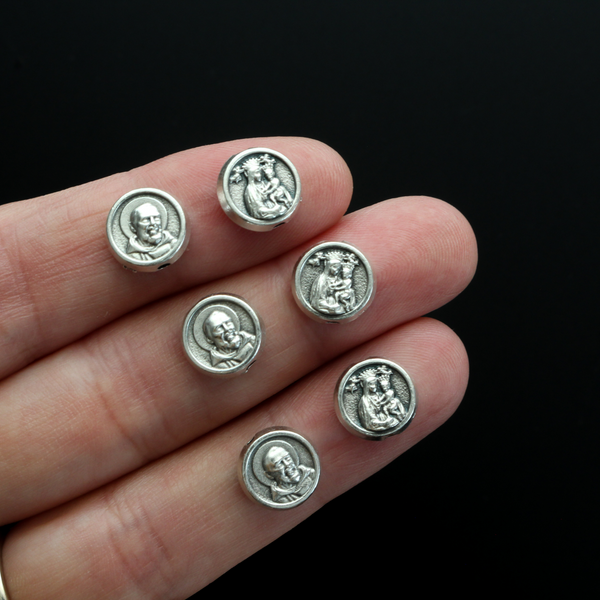 Metal spacer beads that depict Saint Padre Pio on one side and Our Lady of Perpetual Help on the other side.