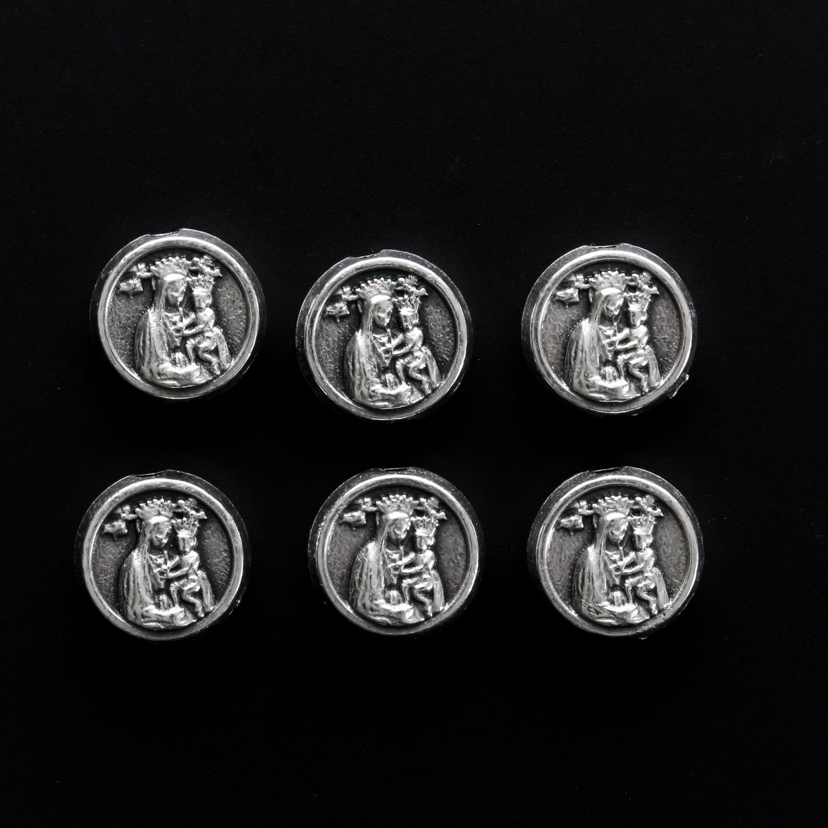 Metal spacer beads that depict Saint Padre Pio on one side and Our Lady of Perpetual Help on the other side.