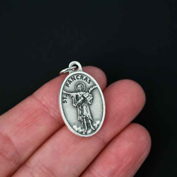 Saint Pancras of Rome medal that depicts the saint on the front and is marked "Pray for us" on the back. Made in Italy.