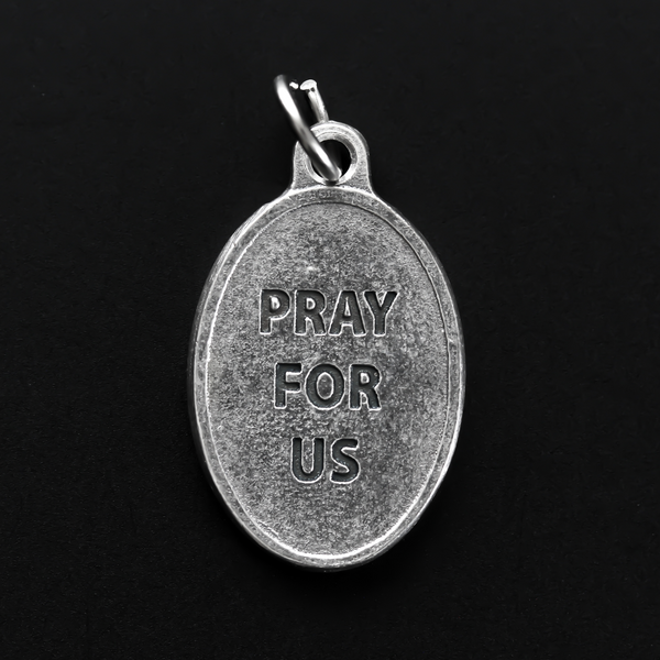 Saint Peter Claver medal that depicts the saint on the front and the reverse side is marked "Pray For Us".