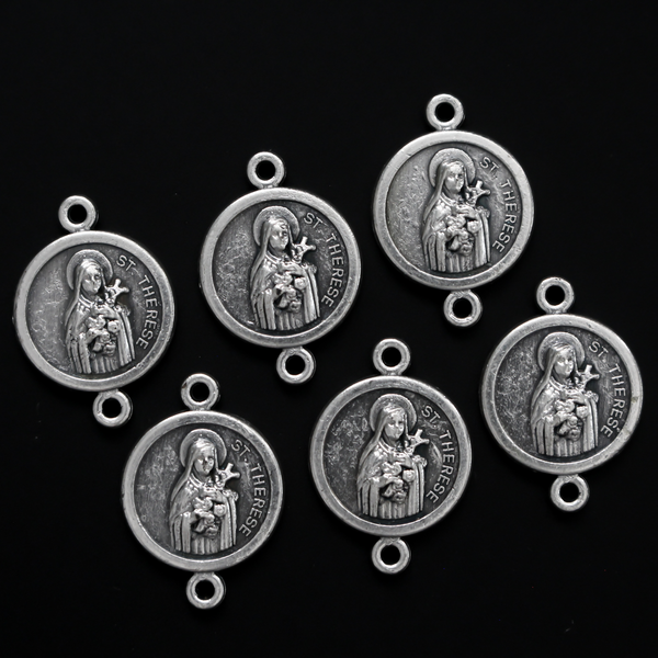 St. Therese of Lisieux round flat connector links that are silver oxidized plating on a base metal 20mm x 14mm