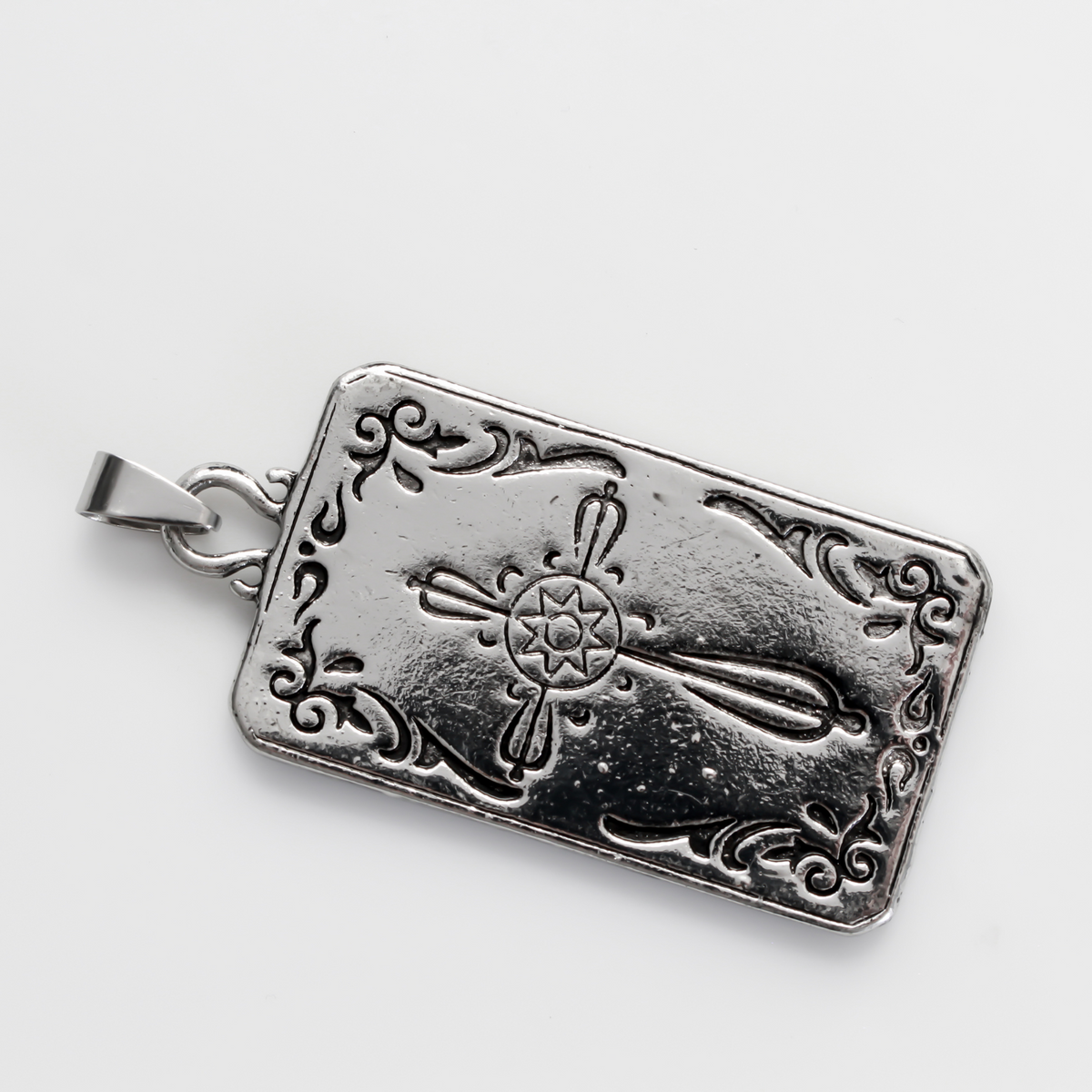 Large tarot card pendant depicting the "Wheel of Fortune" card. There is a jump ring attached to the bail.