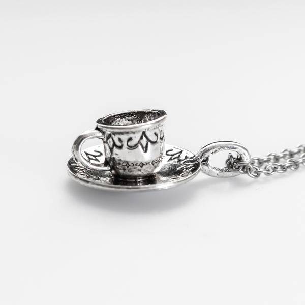 Tiny silver tone cup on a saucer charm. Perfect for coffee or tea lovers! *Necklace is not included*