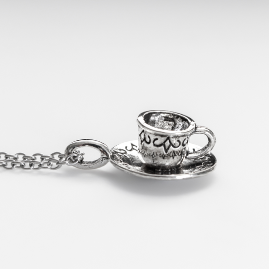 Tiny silver tone cup on a saucer charm. Perfect for coffee or tea lovers! *Necklace is not included*