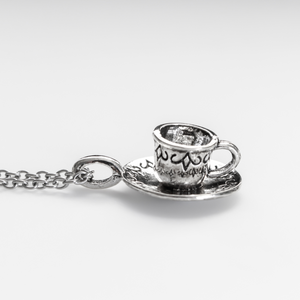 Tiny silver tone cup on a saucer charm. Perfect for coffee or tea lovers! *Necklace is not included*