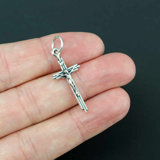 small three bar cross design behind body of jesus
