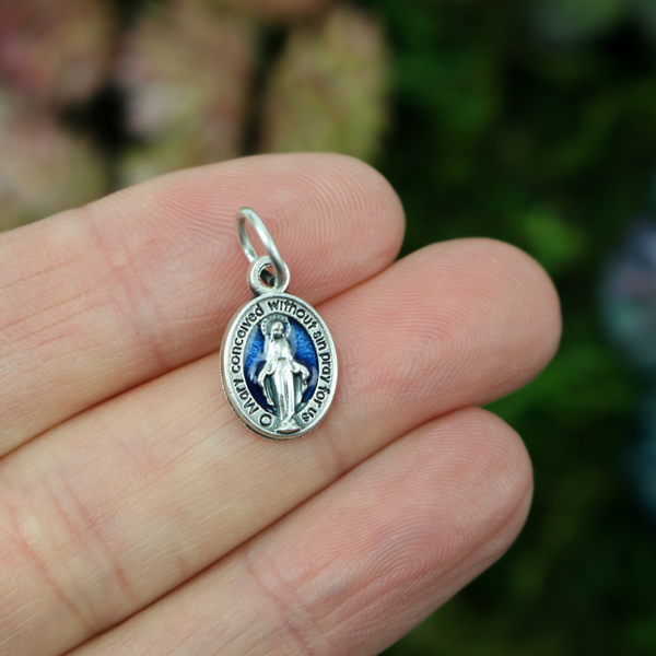 beautifully detailed version of the Miraculous Medal in English with a durable blue enamel accent on the front
