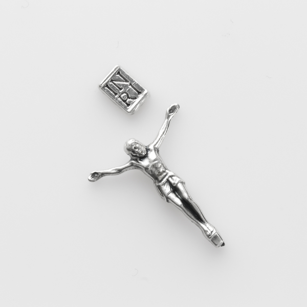 tiny detailed corpus that comes with an INRI sign that can be attached to a cross with a hot glue gun or other adhesive