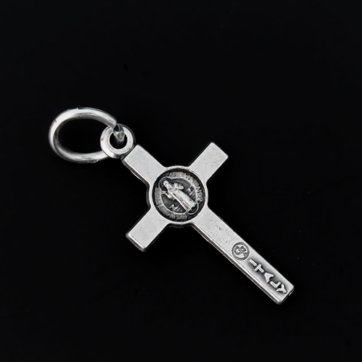 This small but detailed, die-cast (silver oxidized with the finest finish), Saint Benedict medal crucifix is 0.875" (22mm) long and features a St. Benedict medal, front and back