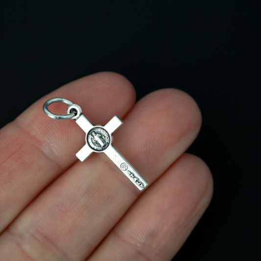 This small but detailed, die-cast (silver oxidized with the finest finish), Saint Benedict medal crucifix is 0.875" (22mm) long and features a St. Benedict medal, front and back