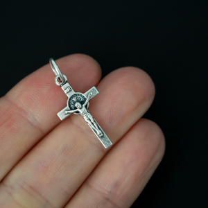 This small but detailed, die-cast (silver oxidized with the finest finish), Saint Benedict medal crucifix is 0.875" (22mm) long and features a St. Benedict medal, front and back