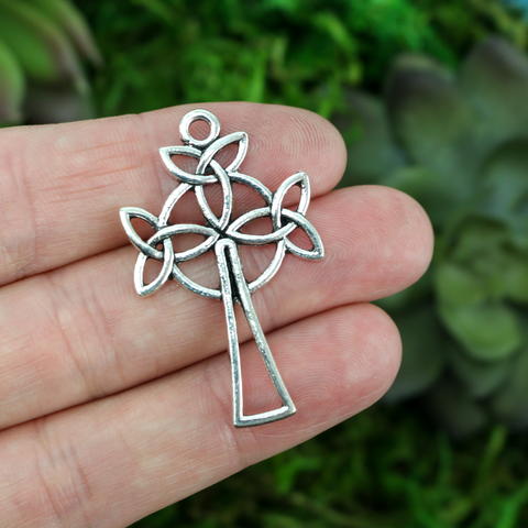 silver tone triquetra knot cross pendant with cut out design