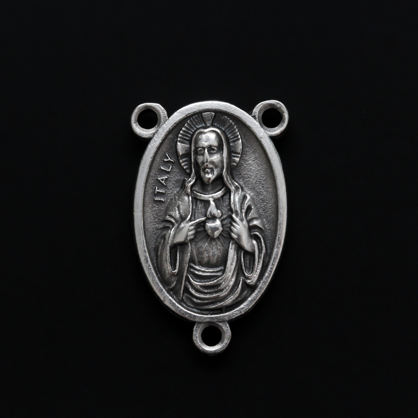 One inch oval rosary centerpiece that features an image of The Immaculate Heart of Mary on the front with an image of The Sacred Heart of Jesus on the back