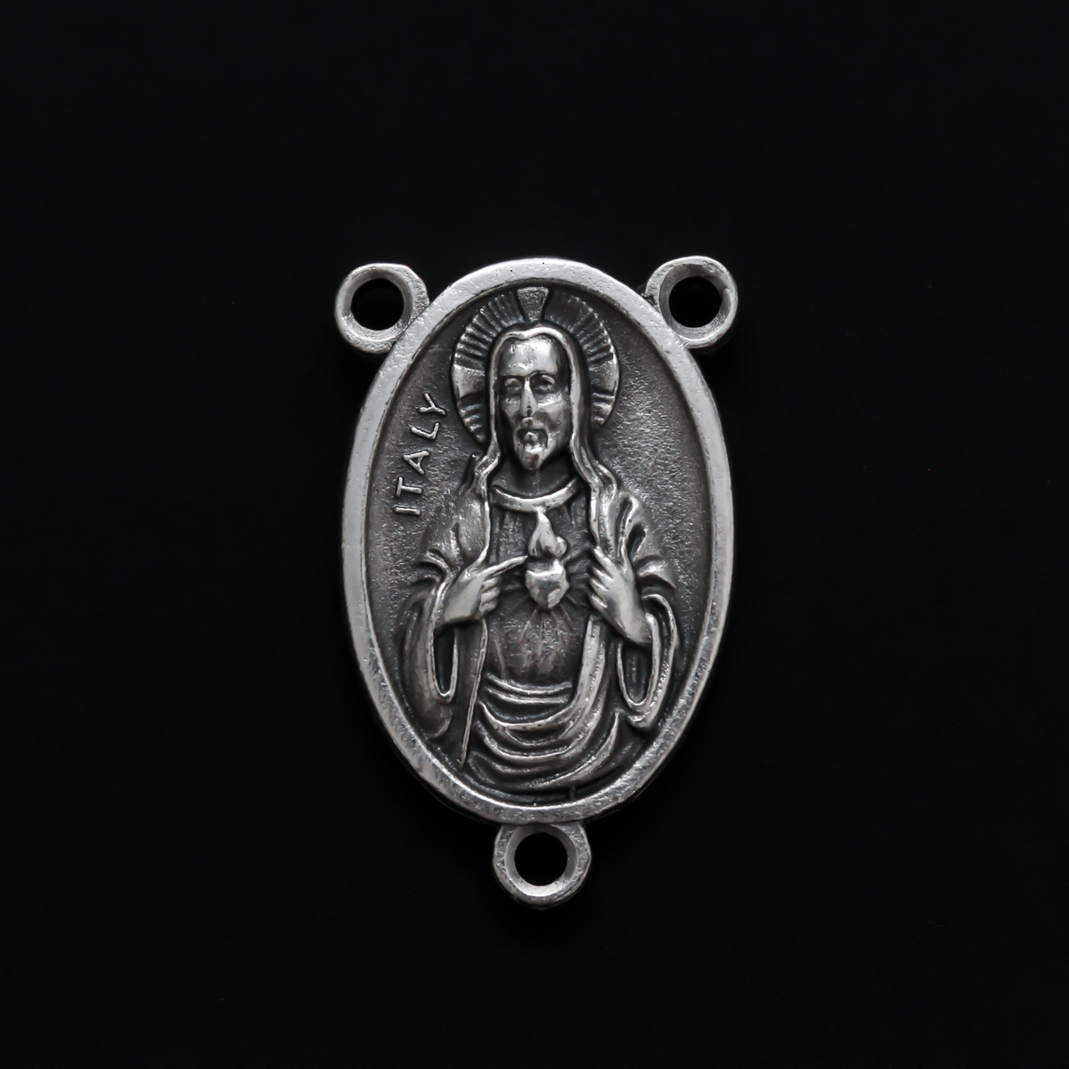 One inch oval rosary centerpiece that features an image of The Immaculate Heart of Mary on the front with an image of The Sacred Heart of Jesus on the back