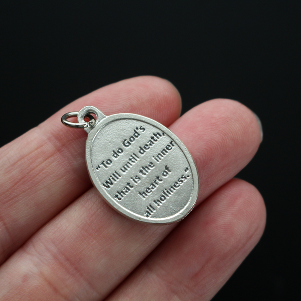 Archbishop Fulton Sheen medal that has one of his quotes on the backside "To do God's will until death, that is the inner heart of all holiness"