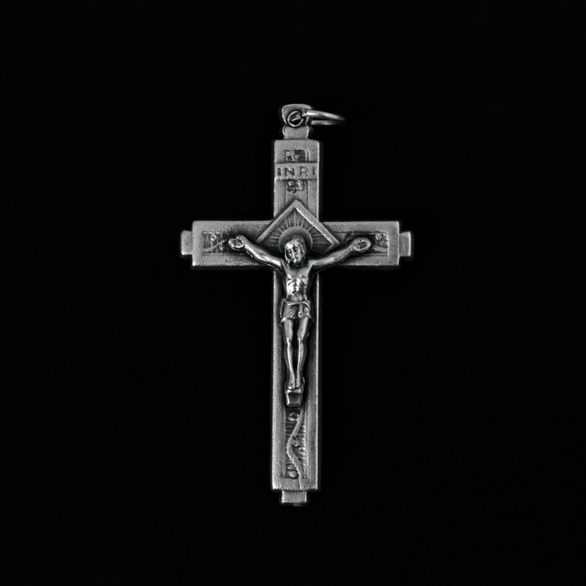 This detailed crucifix was made in Italy and has a sunburst nimbus detail behind the head of Jesus. 