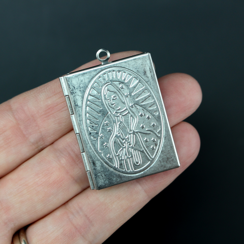 stainless steel photo locket pendant with the virgin mary on the front and back