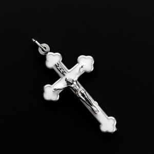Orthodox Byzantine die-cast metal crucifix with a pearlized white enamel inlay
